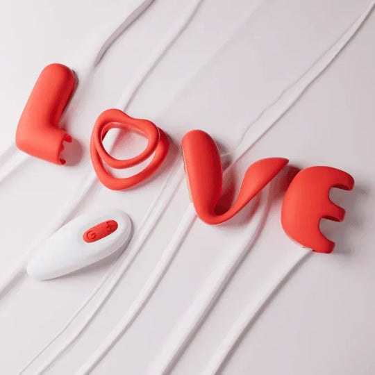 Red silicone couples vibrator set spelling "LOVE" with a white wireless remote.