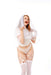 A woman in white lingerie and bridal accessories smiles and blows a kiss to the camera while wearing the Peaches 'n Cream Silicone Lips Open Mouth Gag, adding a flirtatious touch against a plain white background.