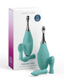 Image of a teal-colored "Pipedream Products Jimmyjane Focus Pro Pinpoint Tip Clitoral Vibrator" with two silicone head attachments, displayed beside its packaging. The box emphasizes that the device is silicone, waterproof.