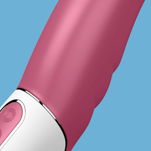 Close-up of the Satisfyer Petting Hippo G-Spot Vibrator in pink and white, featuring a smooth, curved surface, modern design, and button control, set against a solid blue background for a comfortable experience.