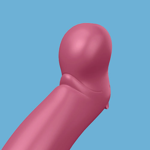 A simplified digital illustration of the Satisfyer Petting Hippo G-Spot Vibrator—a pink, rounded silicone shaft with smooth curves and subtle shading—appears against a blue background.