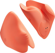Two peach-colored Tracy's Dog Pockety palm vibrators, showing ergonomic S-curve design and heart-wing tip.