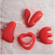 Red silicone couples vibrator set spelling "LOVE" with water droplets, featuring a dual ring and various attachments.