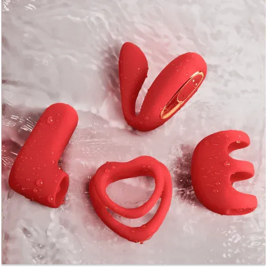 Red silicone couples vibrator set spelling "LOVE" with water droplets, featuring a dual ring and various attachments.