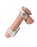 A Male Edge Jes Penis Extender Original - Natural Traction Penis Enlarger (Copy) with metallic joints and white bands, held against a white background.