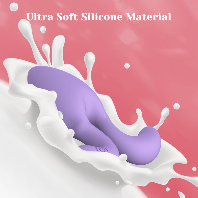 Purple ultra-soft silicone Dorace anal vibrator with tapered tip and flared base, surrounded by white liquid.