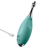 A teal and silver-colored Pipedream Products Jimmyjane Focus Pro Pinpoint Tip Clitoral Vibrator with 2 Head Attachments attached to a USB charging cable, set against a plain white background. The device is marked with small logo designs.