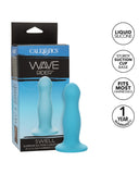 Product packaging for CalExotics Wave Rider Swell Short, Girthy 5 Inch Liquid Silicone Dildo displayed in a box, featuring a blue wavy design and labels such as "1 year warranty" and "fits most harnesses".