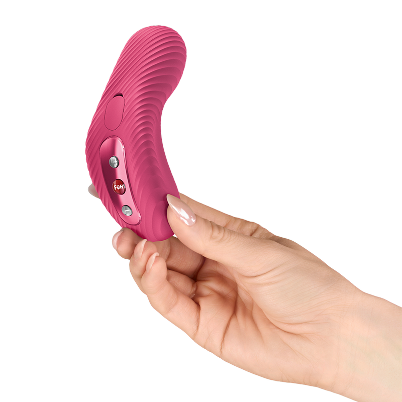 Soft violet Fun Factory Laya 3 lay-on vibrator with ribbed texture, held in a hand.