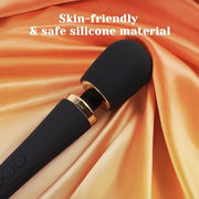 Black silicone Tracy's Dog Hammer Wand vibrator with gold accents on a satin orange fabric.