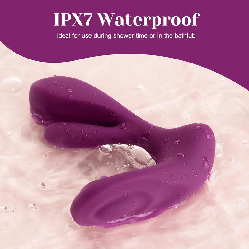 Purple Swirlii wearable vibrator, M-shaped, with water droplets on its soft silicone surface, in a shallow bath.