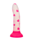 A Glow Stick Heart Silicone First Time Glow in the Dark Dildo by CalExotics, decorated with red heart patterns, featuring a suction cup base, isolated on a white background.