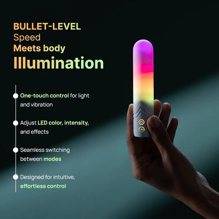Hand holding a white bullet vibrator glowing with a rainbow LED light display and control buttons.