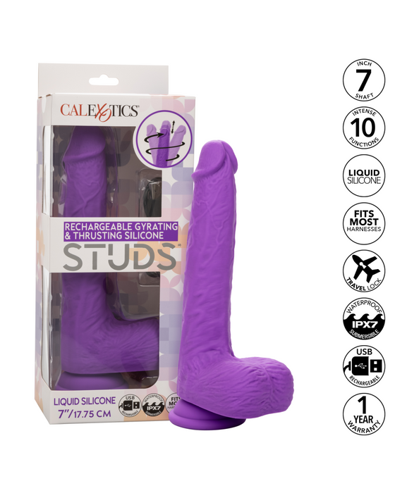 A boxed purple silicone adult toy is shown. The packaging displays the brand "CalExotics" and describes the product as a "Silicone Stud Gyrating & Thrusting 9.5 Inch Purple Dildo." The box also highlights features like a silky silicone finish, 7" length, 10 functions, intense action, waterproof capabilities, and a one-year warranty.