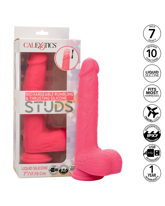 Pink packaging with a pink, vibrating dildo inside. Label indicates it is CalExotics brand, Silicone Stud Rumbling & Thrusting 9.5 Inch Pink Dildo with thrusting and rumbling features. Product benefits listed on the side include silky silicone, rechargeable, harness compatibility, and waterproof.