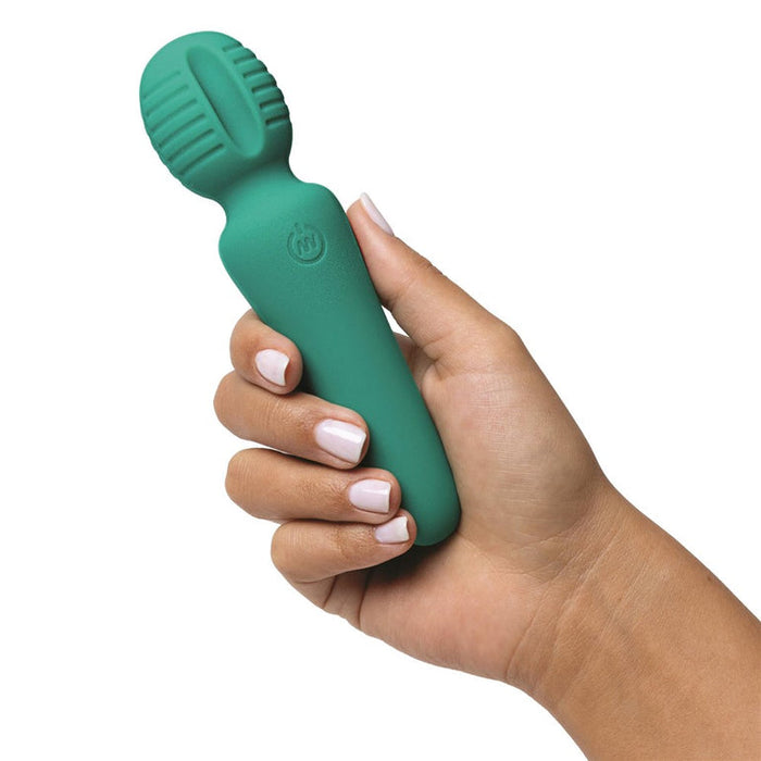 A manicured hand holds the Petite Private Pleasure Waterproof Silicone Wand Vibrator—a green silicone massager with a ribbed, rounded head.