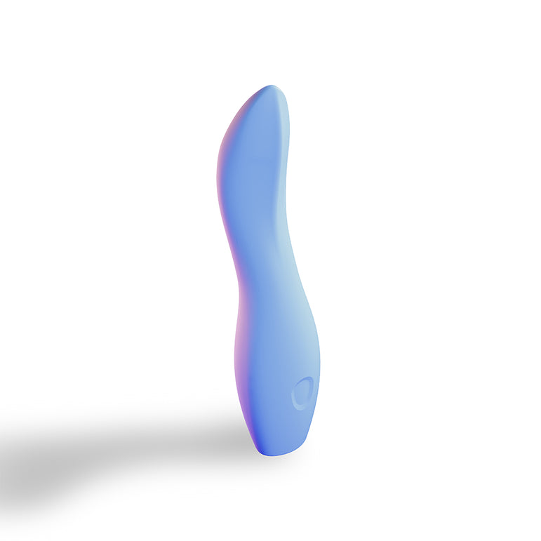The Dame Dip Beginner's Internal & External Silicone Vibrator in Periwinkle stands upright on a white background with a soft shadow to the left, offering gentle, versatile, and waterproof pleasure in an elegant curved design ideal for beginners.