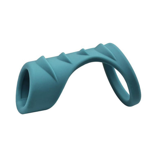 The Adam & Eve Ridged Cock Cage with Shaft Support is a teal, curved stretchy silicone toy featuring two differently sized rings on each end and textured ridges along the top, shown against a white background.