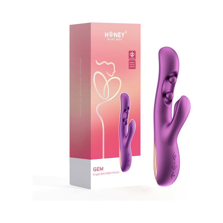 A purple Gem Pressure Sensing App-Controlled Twin Balls Rabbit (Damaged Box) stands beside its pink and orange gradient box, which showcases a line illustration of the toy and highlights its twin ball movement features.