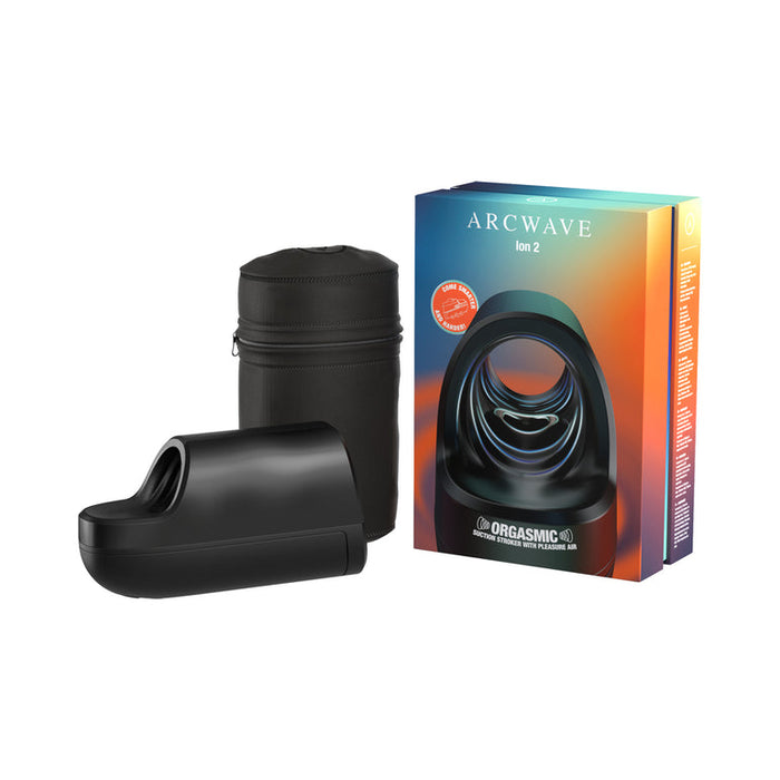 The Arcwave Ion 2 Penis Masturbator with Pleasure Air Suction in sleek black is shown beside its cylindrical storage case and vibrant packaging featuring the product name and image.
