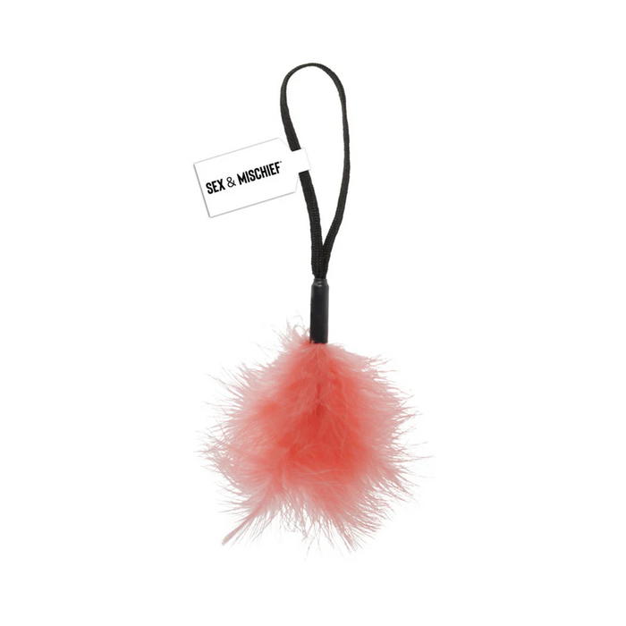 The Peaches 'n Cream Wrist Feather Tickler features peach feathers, a black handle, and wrist loop—ideal for playful sensory exploration in your intimate moments.