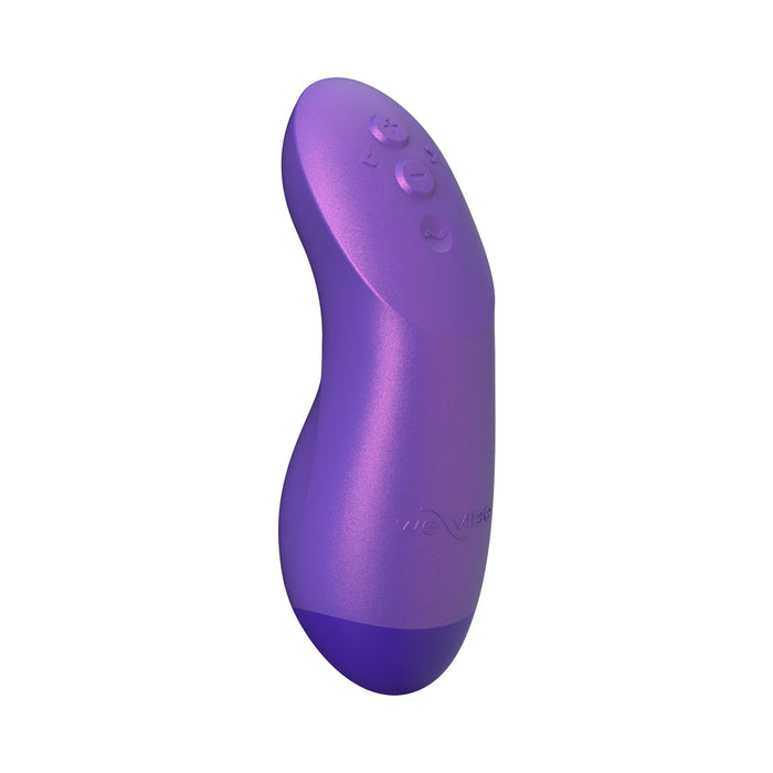 The We-Vibe Chorus Pro Wearable Couples' Vibrator with triple motors and remote is a curved purple device with three buttons on top and an ergonomic design for G-spot stimulation, photographed against a white background.