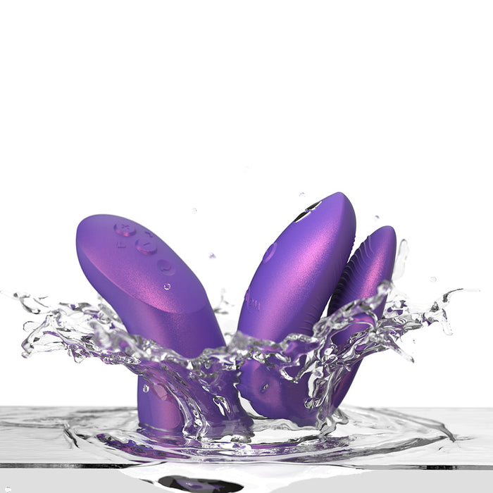 Three We-Vibe Chorus Pro Wearable Couples' Vibrators with triple motors and remote splash into water, highlighting their smooth finish, wearable design, G-spot stimulation, and innovative waterproof features.