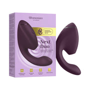 The Womanizer Next Duo Pleasure Air + Vibration Blended Orgasm Stimulator in purple is shown beside its box, featuring “Advanced 3D Pleasure Air with G-Spot vibrations” and “14 intensity levels.”.