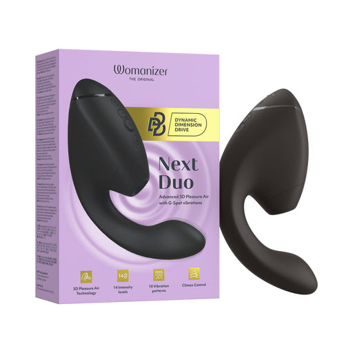 A Womanizer Next Duo Pleasure Air + Vibration Blended Orgasm Stimulator in black sits next to its yellow and purple box, which showcases 3D Pleasure Air Technology, 14 intensity levels, and 10 vibration patterns.