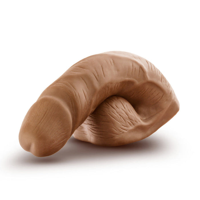 The URSELF 5 Inch Chocolate Silicone Packer Dildo is made from body-safe platinum-cured silicone for a realistic feel, shown in brown on a white background.