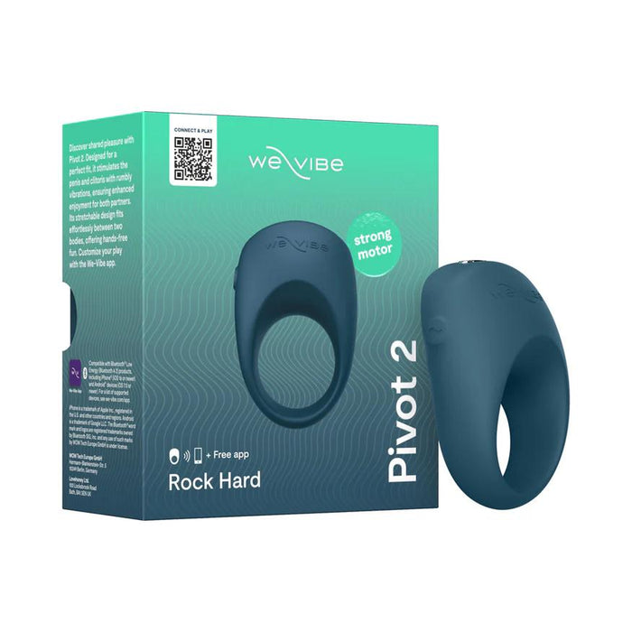 A teal We-Vibe Pivot 2 Vibrating Silicone Rechargeable Penis Ring is displayed beside its packaging, which showcases hands-free clitoral stimulation, a strong motor badge, app compatibility info, and the phrase “Rock Hard.”.