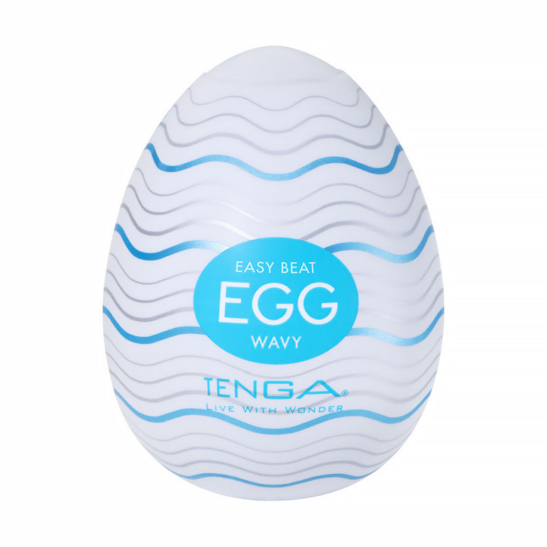 A white, egg-shaped male masturbator with wavy blue lines, featuring a textured sleeve for heightened pleasure. Sold as the "Tenga Egg Standard 3 Pack Disposable Masturbators I," with branding on the front.