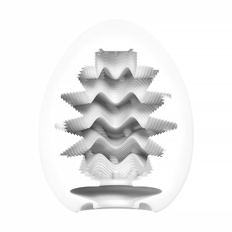 A white, egg-shaped Tenga Egg Standard 3 Pack Disposable Masturbators I is cut in half to reveal its intricate, wavy internal sleeve with spikes and ridges for textured male pleasure. The background is plain white.