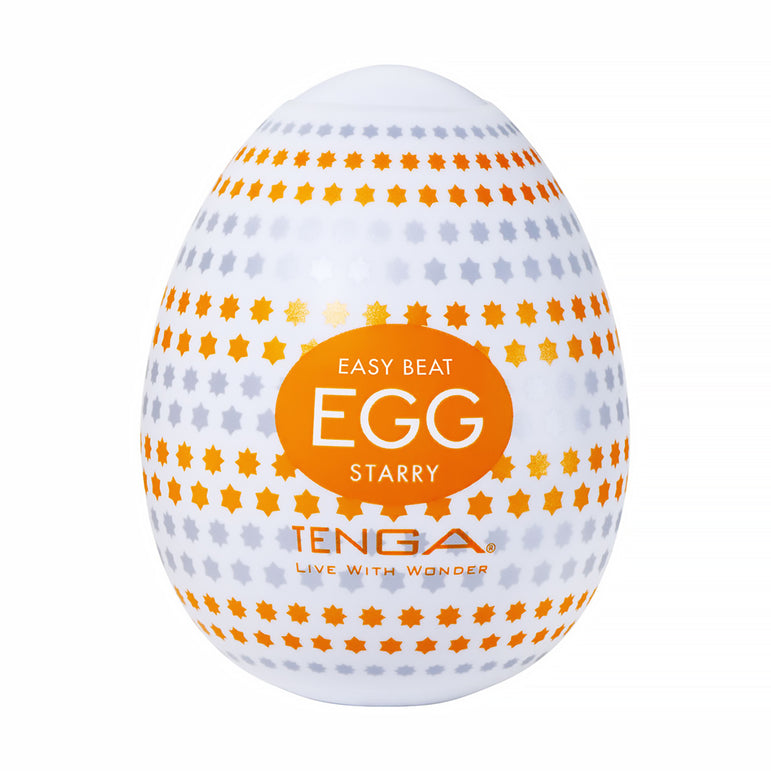 A white Tenga Egg with orange and gray star patterns, labeled "EASY BEAT EGG STARRY" and "TENGA LIVE WITH WONDER," is part of the Tenga Egg Standard 3 Pack Disposable Masturbators I and features a textured sleeve for enhanced sensation.