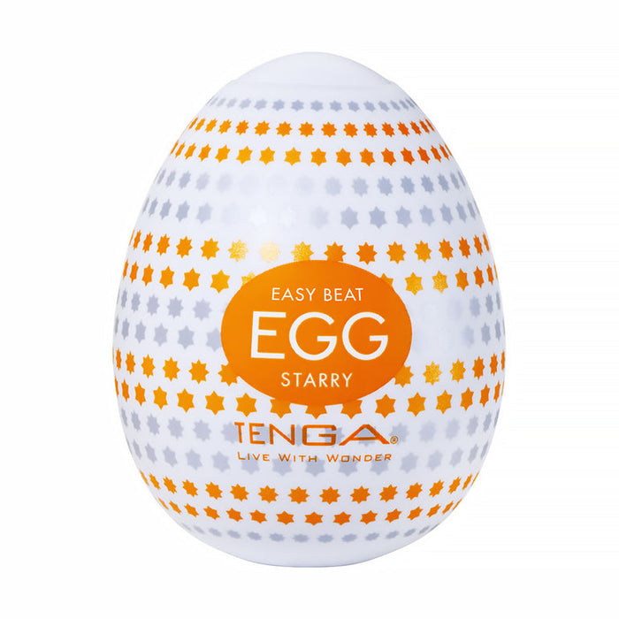 A white Tenga Egg with orange and gray star patterns, labeled "EASY BEAT EGG STARRY" and "TENGA LIVE WITH WONDER," is part of the Tenga Egg Standard 3 Pack Disposable Masturbators I and features a textured sleeve for enhanced sensation.