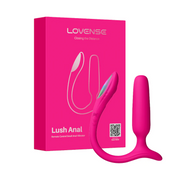 A Lovense Bluetooth App Controlled Vibrating Anal Plug in pink is shown beside its vibrant packaging, which displays an illustration of the product and the Lovense brand name.