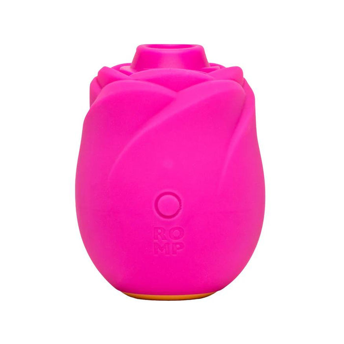 The Romp Rose 2 Pleasure Air Clitoris Stimulator in bright pink features a rose-shaped, rechargeable silicone design with "ROMP" embossed on the front, shown against a white background.