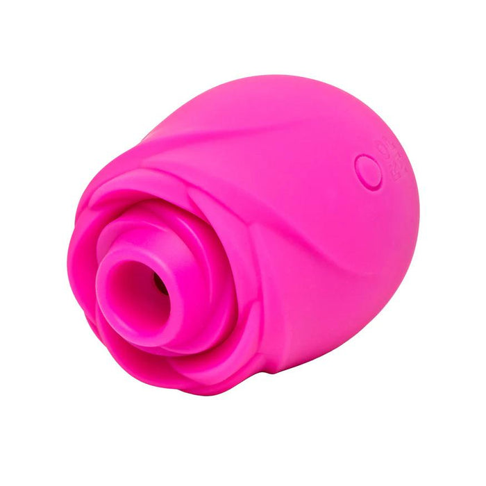 The Romp Rose 2 Pleasure Air Clitoris Stimulator is a bright pink, rose-shaped rechargeable silicone massager with a circular opening, designed to resemble a flower for clitoral stimulation.