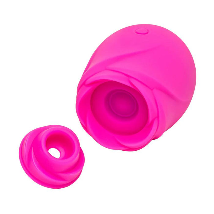 The Romp Rose 2 Pleasure Air Clitoris Stimulator in bright pink features a rechargeable silicone design with a detachable petal-like cover, shaped like a rose and shown against a white background.