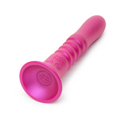 Pink silicone ROMP Jiggle thrusting vibrator with a strong suction base and ribbed design.