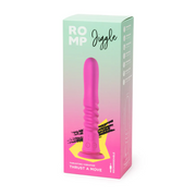 Pink silicone ROMP Jiggle thrusting vibrator with suction base, shown in its pastel green and pink retail box.