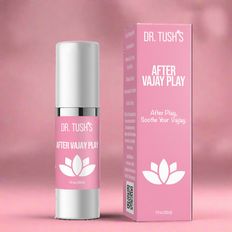 A pink bottle and box labeled "DR. TUSH'S AFTER VAJAY PLAY" contains After Vajay Play Soothing Lotion for Irritated Vaginal Tissues, a 1 fl oz (30ml) cooling gel with lotus graphic and the tagline "After Play, Soothe Your Vajay." Pink background.