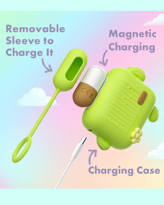 A cute, green, dog-shaped charging case is shown with a removable protective sleeve and magnetic charging feature. An arrow points to a white charging cable at the bottom with text indicating "Charging Case," while another highlights the "Removable Sleeve to Charge It." This travel-friendly **Blooming Bliss First Time Bullet & Egg Vibrators with Charging Case & Remote by Blush** adds convenience on the go.