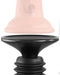 Close-up of a two-piece object, one part being a smooth, light pink featureless ring or cap with a globe logo, and the other part being a black, shaped base with ridged edges reminiscent of the Body Dock Thruster Powerful Thrusting Suction Cup Sex Toy Mount. The pieces are separated and aligned vertically facing each other.