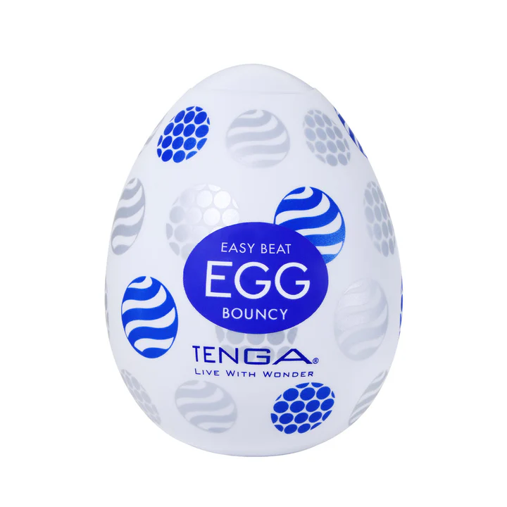 White Tenga Egg Bouncy masturbator with blue and silver textured circles, "EASY BEAT EGG BOUNCY" text.