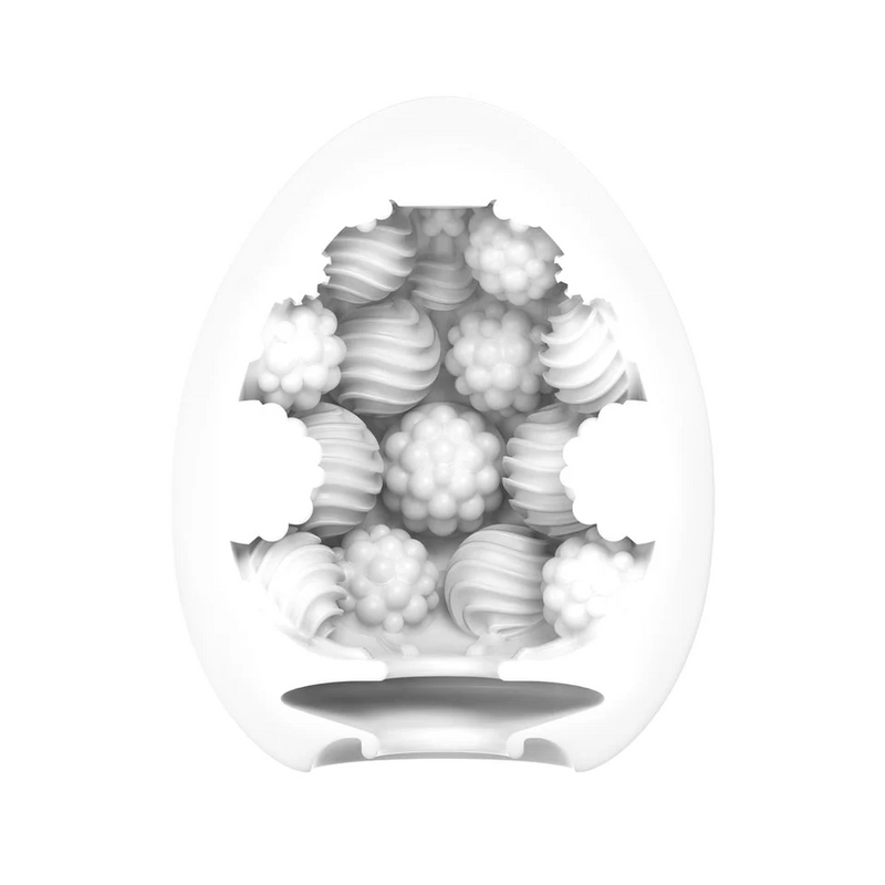White Tenga Egg Bouncy masturbator, revealing a textured, spherical TPE sleeve with wavy and bumpy patterns.