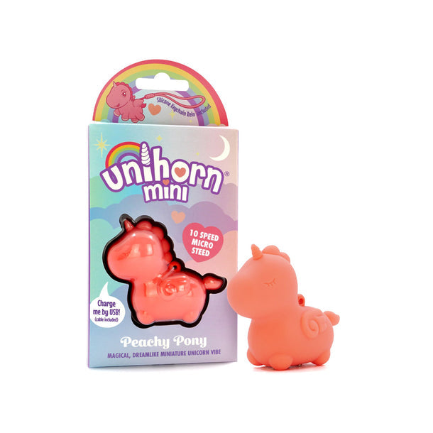 A small, peachy Unihorn Mini - Peachy Pony Discreet Vibrator made from body-safe silicone sits beside its pastel, whimsical box, which showcases it as a 10-speed mini vibrator.