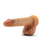 A Blush DaVinci Ultra Realistic 8 Inch Silicone Dildo with Sliding Foreskin - Caramel with detailed texture and coloration is shown against a plain white background. The dildo, complete with a suction cup base for versatile use, includes a shaft, head, and testicles, appearing in natural skin tones.