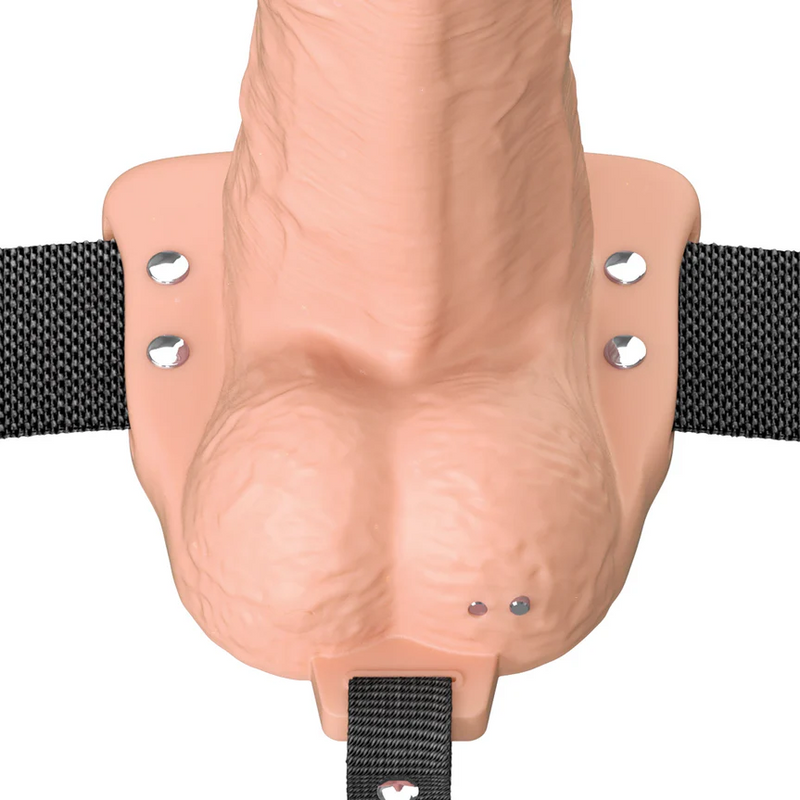 Vanilla Elite Silicone hollow dildo with black strap-on harness and silver rivets.