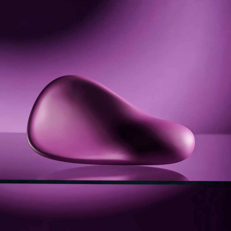 Smooth, compact, deep purple silicone vibrator with a cupped shape, designed for oral play.